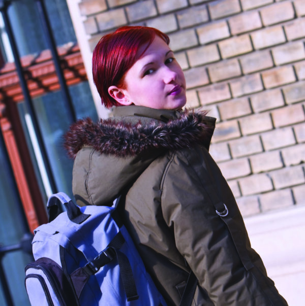 teenage girl wearing backpack