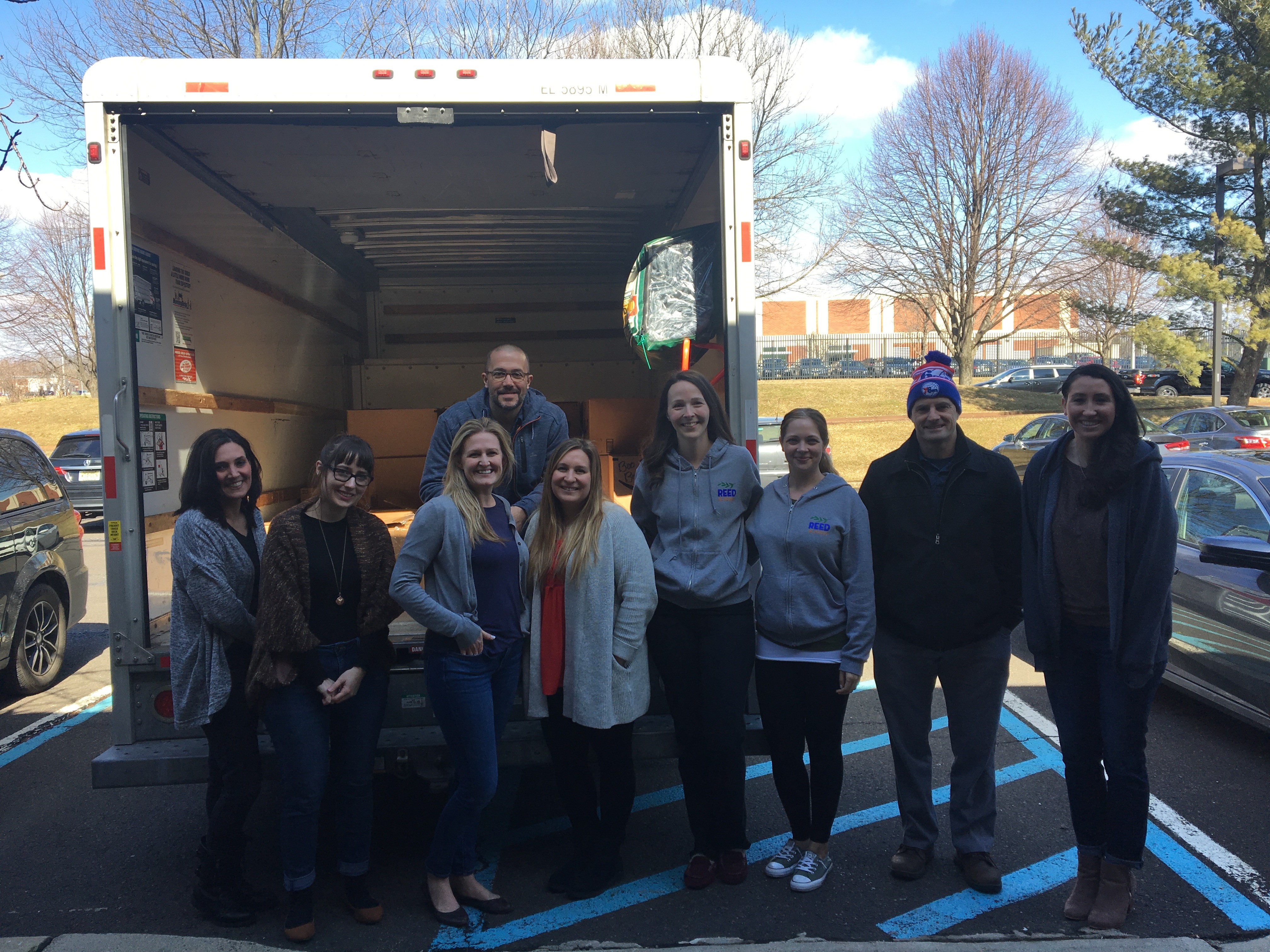 Autism New Jersey employees and Reed representatives load up truck