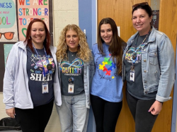 Teachers wearing autism acceptance t-shirts